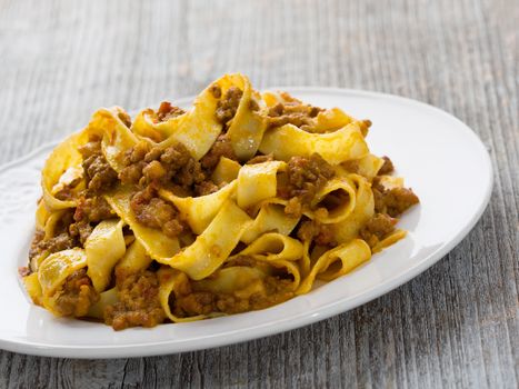 close up of rustic traditional italian pappardelle bolognese