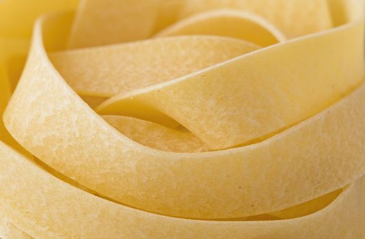 close up of raw uncooked italian pappardelle pasta noodle