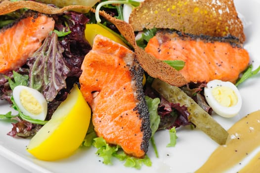 Caesar salad with grilled salmon and quail eggs