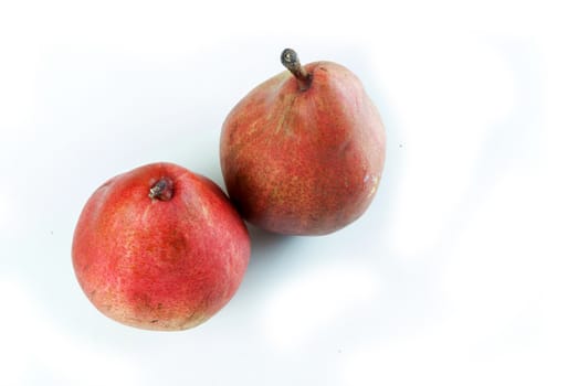 Ripe red pear fruits on white background