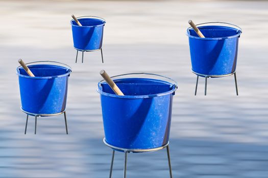 Windows cleaning water in blue plastic eggs. Blurry background.
