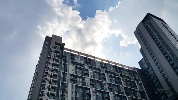 Condominium and the cloudy sky.