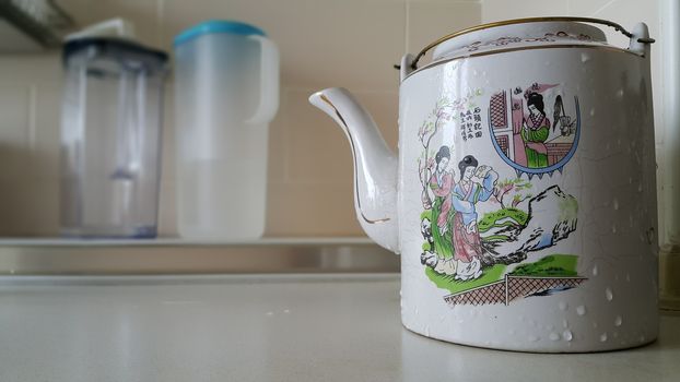 Chinese style tea pot in the kitchen.