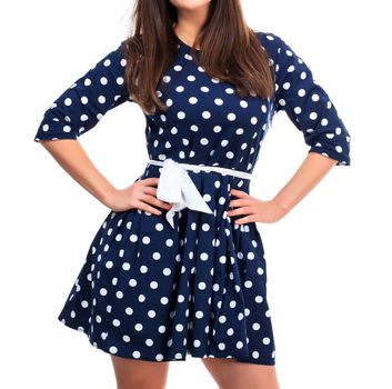 Woman in a dress with polka dot print, isolated on white background