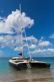 Great shot of a catamaran in Portrait format taken off the beach in St Nevis near St Kitts in the Caribbean