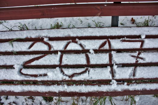 inscription on the snow on the bench digits 2017