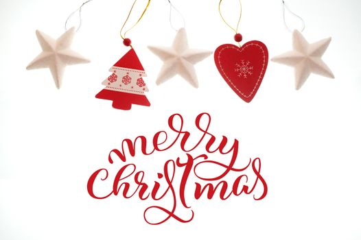Festive Christmas Toys isolated on white background and text Merry Christmas. Lettering calligraphy.