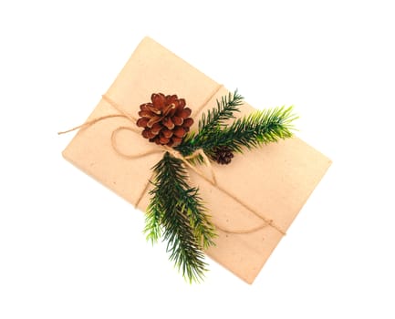 festive box of kraft paper with fir branch.