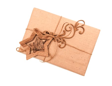 festive box of kraft paper with toy wooden star.