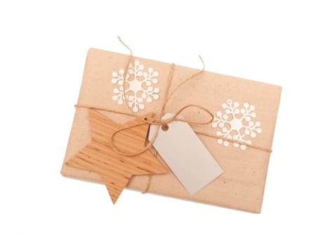 festive box of kraft paper with toy wooden star.