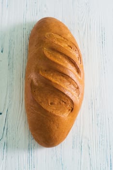 Loaf bread on old wooden background
