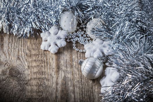 White christmas balls on a wooden background. 