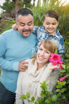 Happy Mixed Race Family Portrait Outdoors.