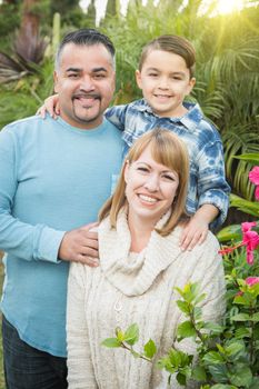 Happy Mixed Race Family Portrait Outdoors.