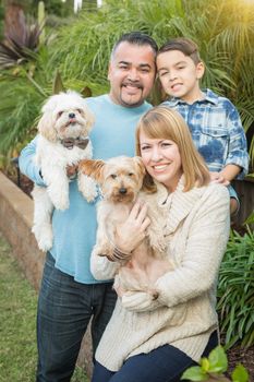Happy Mixed Race Family Portrait Outdoors.