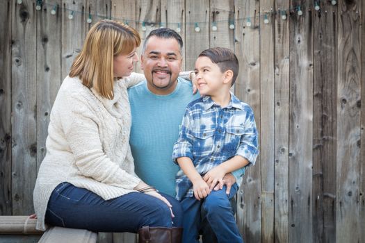 Happy Young Mixed Race Family Portrait Outside.