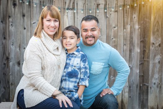 Happy Young Mixed Race Family Portrait Outside.