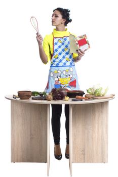 Housewife is preparing in the kitchen on a white background