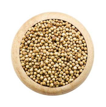 coriander seeds in a wooden dish isolated on white background, Saved clipping path.