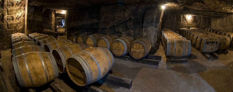 Barrels in old cellar, Bordeaux winery, France