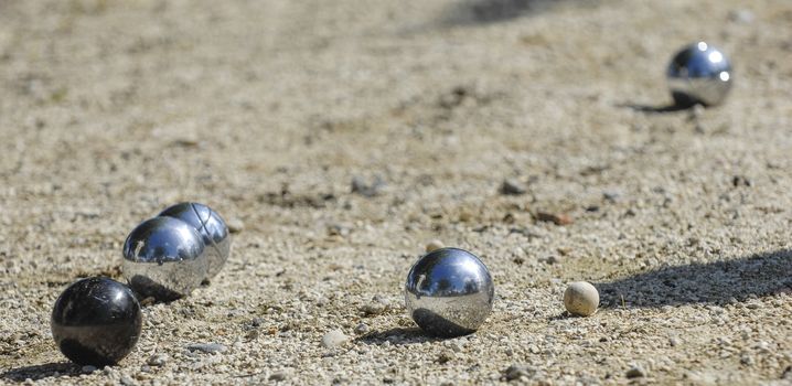Metallic petanque three balls and a small wood jack, France