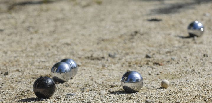 Metallic petanque three balls and a small wood jack, France