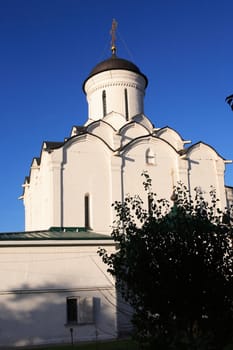 View of nice ancient Russian monastery against blue sky, city of Vladimir