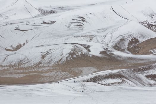 Snow adds to the tourist attraction of the tallest dunes in North America at Great Sand Dunes National Park and Preserve in Colorado's San Luis Valley.  Date is May 27, 2016. 