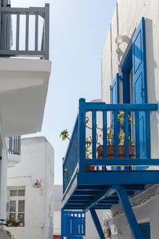 Blue terrace on a white washed walled house in Mykonos in Greece - traditionally Greek