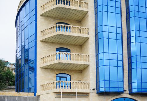 multi-storey office building with balconies in city
