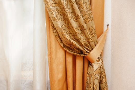 beautiful golden curtain in the bedroom near window