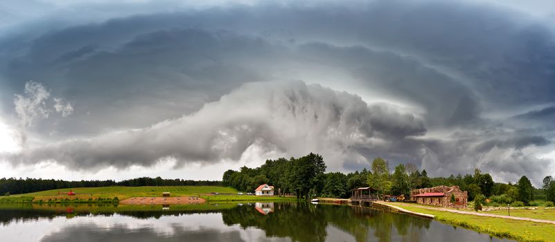 Summer storm landscape. Dramatic cloudy sky. Hurricane and rain in Belarus