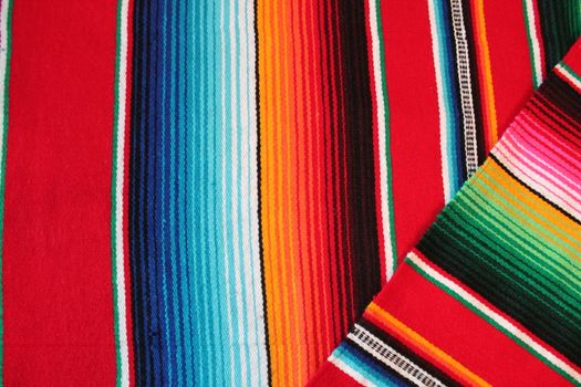 Mexico traditional cinco de mayo rug poncho fiesta background with stripes copy space