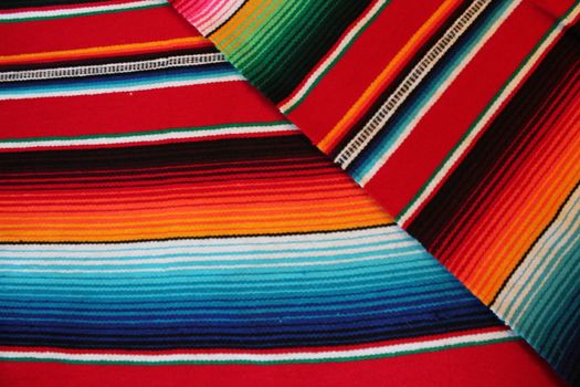 Mexico traditional cinco de mayo rug poncho fiesta background with stripes copy space