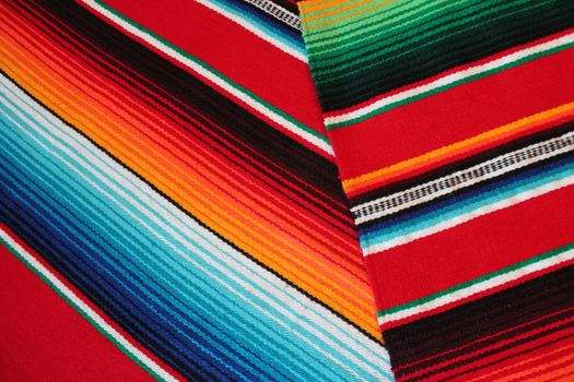 Mexico traditional cinco de mayo rug poncho fiesta background with stripes copy space