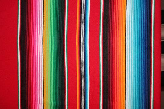 Mexico traditional cinco de mayo rug poncho fiesta background with stripes copy space