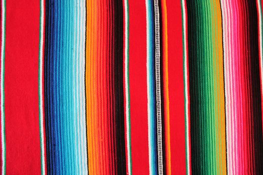 Mexico traditional cinco de mayo rug poncho fiesta background with stripes copy space