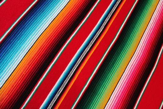 Mexico traditional cinco de mayo rug poncho fiesta background with stripes copy space