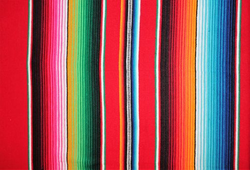 Mexico traditional cinco de mayo rug poncho fiesta background with stripes copy space