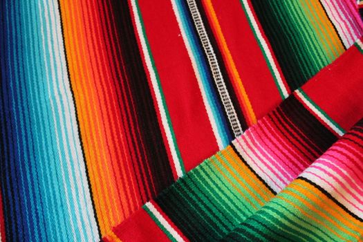 Mexico traditional cinco de mayo rug poncho fiesta background with stripes copy space