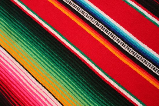 Mexico traditional cinco de mayo rug poncho fiesta background with stripes copy space