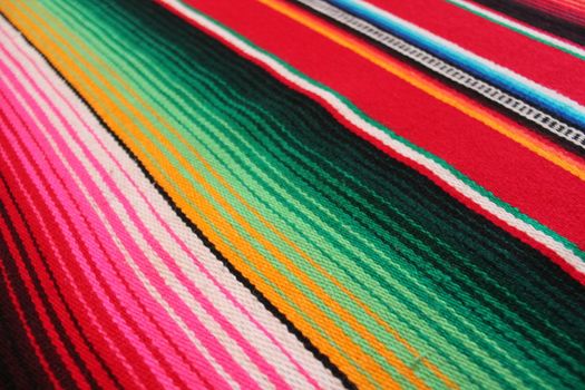 Mexico traditional cinco de mayo rug poncho fiesta background with stripes copy space