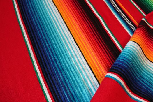 Mexico traditional cinco de mayo rug poncho fiesta background with stripes copy space