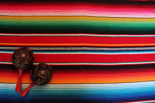 Mexico traditional cinco de mayo rug poncho fiesta background with stripes copy space