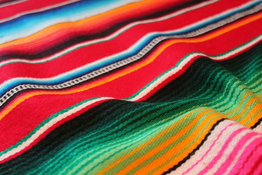 Mexico traditional cinco de mayo rug poncho fiesta background with stripes copy space