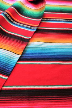 Mexico traditional cinco de mayo rug poncho fiesta background with stripes copy space