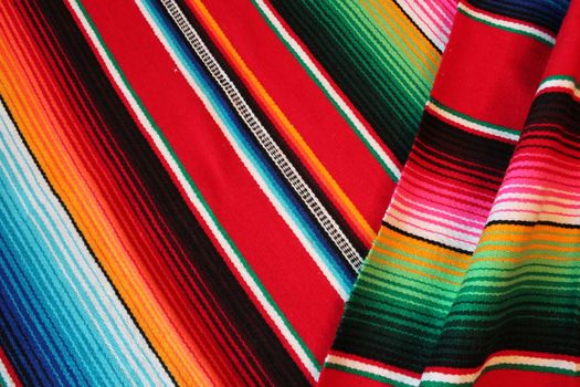 Mexico traditional cinco de mayo rug poncho fiesta background with stripes copy space