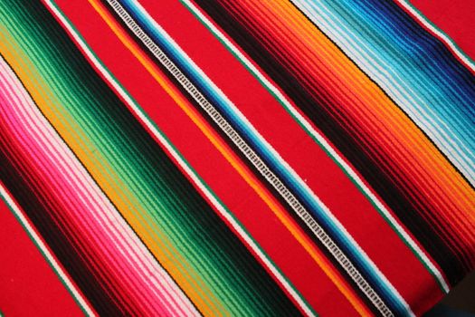 Mexico traditional cinco de mayo rug poncho fiesta background with stripes copy space