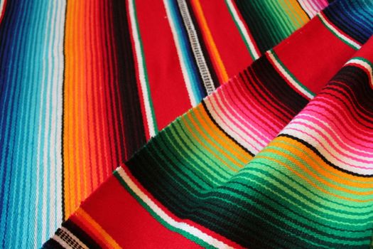 Mexico traditional cinco de mayo rug poncho fiesta background with stripes copy space