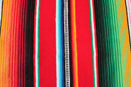 Mexico traditional cinco de mayo rug poncho fiesta background with stripes copy space